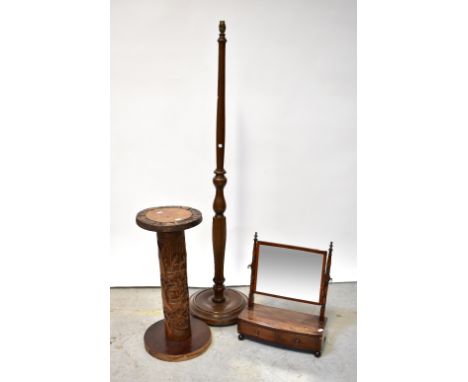 An early 19th century mahogany swing toilet mirror with two drawers to the faux fronted base, width 40cm, a standard lamp and