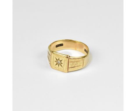 A gentlemen's vintage signet ring with a central star cut inset diamond, on square table, line decoration to each shoulder, o