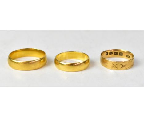 Three yellow gold wedding bands, comprising two 22ct examples, sizes O1/2 and S, combined approx 11.6g and an 18ct example, s