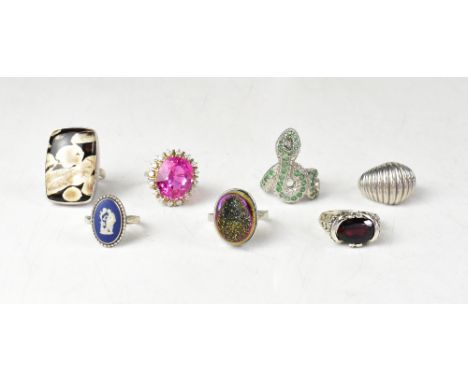 Seven unusual silver and gemstone fashion rings, comprising a sterling silver and polished peanut wood dress ring, size R, a 