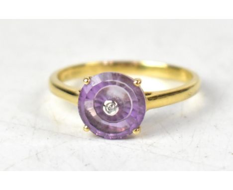 A 9ct yellow gold Lahrer Torus amethyst and diamond ring, the central bezel set tiny diamond within a bezel cut claw set amet