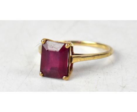 A 9ct gold ruby ring, the single octagonal claw set ruby approx 1.6ct, mounted on a 9ct yellow gold shank, size S, approx 2.6