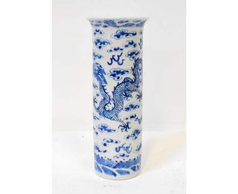 A 19th century Chinese blue and white cylindrical vase with flared rim, decorated with water dragons with five talons, chasin