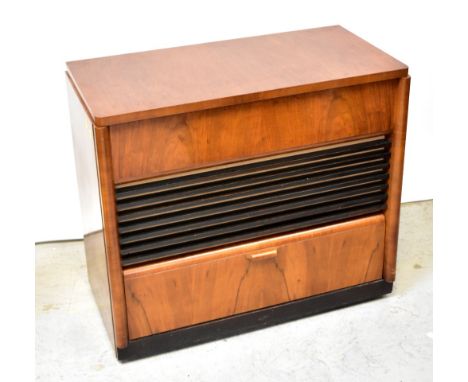 A vintage His Master's Voice record and radio cabinet comprising a Garrard model 3500 turntable and tuner, over speaker secti