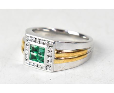 A gentlemen's modern 14K two-tone gold emerald and diamond ring, the central square comprising four invisible set square set 