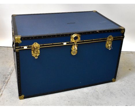 A large modern alloy metal bound trunk.