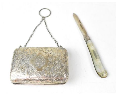 An Edwardian silver purse with engine turned foliate decoration, cartouche with initials 'BE' and crown entwined, with burgun