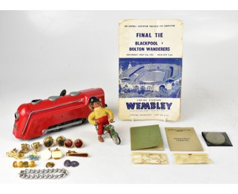 Various mixed collectibles to include a 1930s red painted tinplate clockwork locomotive, a hedgehog figure riding a vintage m