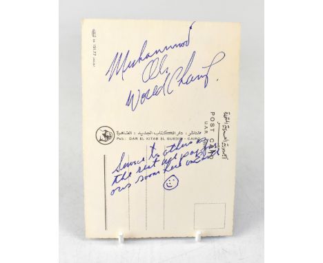 MUHAMMAD ALI; a postcard bearing the boxing champion's signature, with further inscription 'Service to others...'.We have not