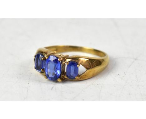 A 9ct yellow gold ring with three graduated claw set Tibetan kyanite, size O, approx 3g.