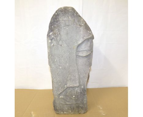 A contemporary carved Lake District stone sculpture of triangular form, a tall figure of a man's face over the word 'Love', h