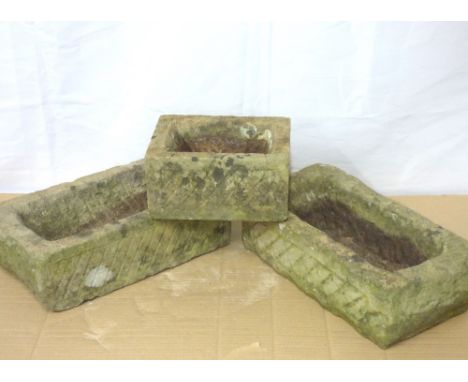 Three carved stone trough planters, hand carved from Lake District stone by Norman Pettiford of Austwick, two 10 x 33 x 18cm 