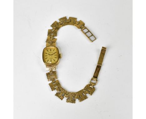 EVERITE; a ladies' 9ct gold wristwatch, the rectangular dial set with raised baton numerals, crown wind seventeen jewel Incab
