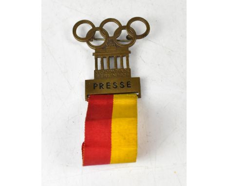 OLYMPIC GAMES; a 1936 Olympic Games Press badge in the form of the Nuremberg Gate with the five Olympic Rings above, stamped 