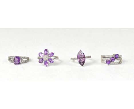 Four hallmarked silver amethyst and topaz rings, comprising a purple amethyst and white topaz ring with three rows of diagona