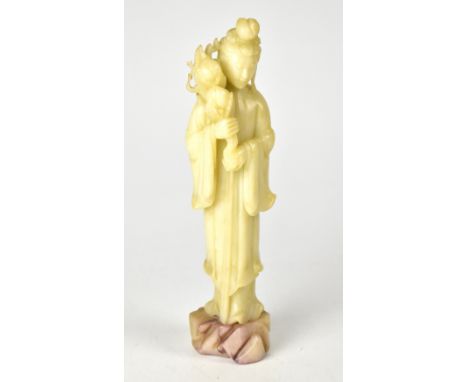 A 20th century jade-style carved figure of a geisha holding a branch of flowers, on naturalistic base, height approx 29cm.