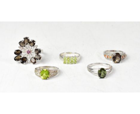 Five various gemstone set sterling silver rings, comprising a large contemporary smoky quartz and rhodolite garnet and diamon