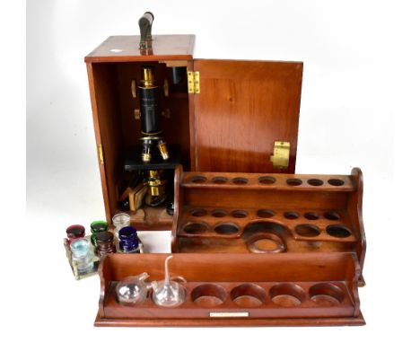 A mahogany cased black lacquered and brass monocular microscope inscribed 'Service' by W. Watson &amp; Sons Ltd, London, numb