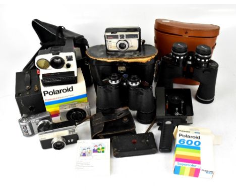 A mixed lot of cameras and binoculars to include WWII night vision binoculars, a Polaroid camera and unused film, a Rolls Aut