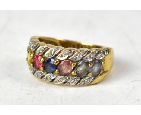 A 9ct gold multicoloured fancy sapphire and diamond ring, the central row of seven oval cut sapphires of different colours, t