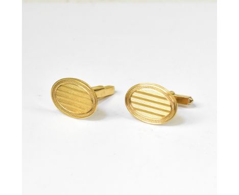 A pair of vintage gentlemen's 9ct gold oval cufflinks with horizontal engine turned decoration, within a small crosshatched b