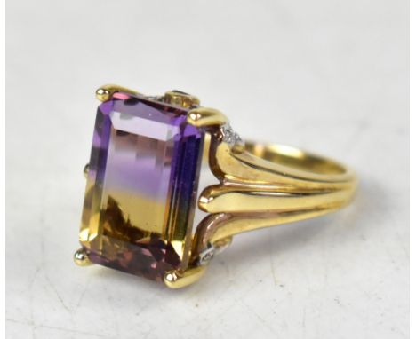 A 9ct yellow gold ring with an emerald cut ametrine bi-colur stone, on an ornate mount, size N, approx 5.5g. CONDITION REPORT