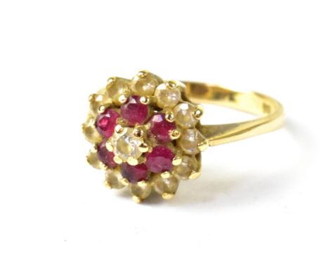 A 9ct yellow gold ladies' dress ring, floral set with white and red stones, size L, approx 2.8g.