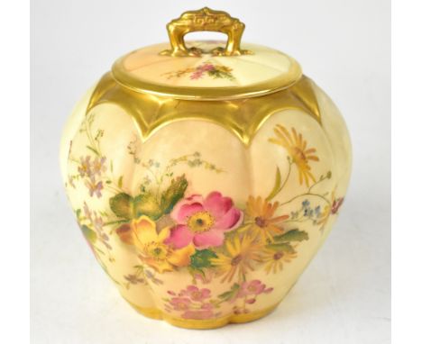 ROYAL WORCESTER; a blush ivory floral decorated globular jar and cover, with pierced loop handle and lobed body, puce printed