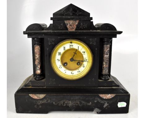 A late 19th century French black slate mantel clock, with eight day movement, the chapter ring set with Arabic numerals, heig