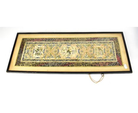 A Chinese embroidered silk panel, the central section with a pheasant and butterflies within wisteria and other lilac and blu