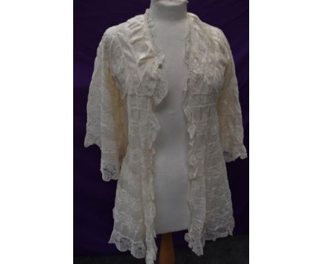 A very decadent cream silk and lace late Victorian/Edwardian bed jacket.
Very very good, has had a ribbon to neckline at some