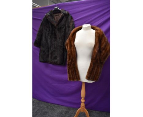 A dark brown fur jacket and a mink wrap,both around 1950s.
