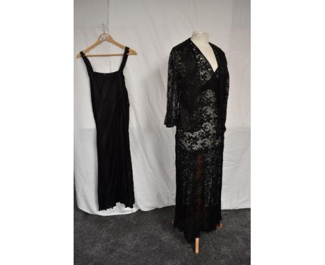 A 1930s black lace sheer evening dress having bias cut panelled skirt sold with unmatched but similar jacket and a dress line