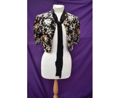 A 1930s floral embroidered crepe bolero or short jacket with pussy bow to neck.
Very good condition with little wear