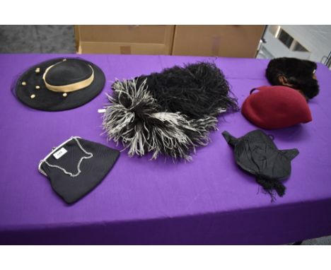 A mixed collection of items including vintage and antique hats, a Victorian bag/purse and a black evening bag.