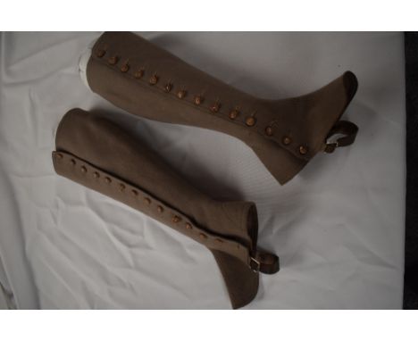 A pair of Edwardian beige wool ladies gaiters with button sides.