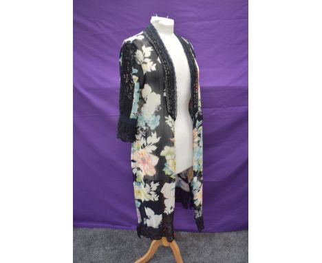 A sheer vintage floral over jacket having lace detailing.