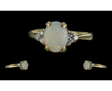 Ladies 9ct Gold Attractive Opal and Diamond Set Ring. Full Hallmark to Shank. Pleasing Opal of Oval Form, With 6 Small Diamon