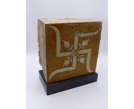A LARGE INDO PERSIAN POTTERY AND MARBLE BLOCK TILE WITH HINDU / BUDDHIST SWASTICA INLAID DECORATION. NOW MOUNTED ON MUSEUM TY