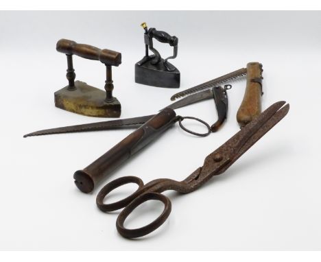 A PAIR OF EARLY WROUGHT IRON HEDGING SHEARS, A PAIR OF TAILORS SCISSORS, THREE FOLDING KNIVES, TWO FLAT IRONS AND OTHER DOMES