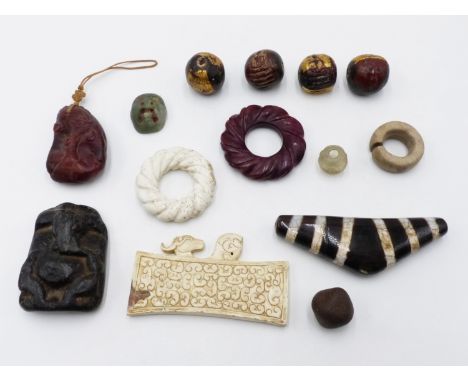 A GROUP OF ORIENTAL ARCHAISTIC AND OTHER ARTIFACTS. TWO CARVED ROPE FORM BI DISCS. A WHITE STONE AXE TABLET SURMOUNTED WITH R