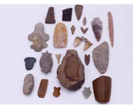 A  WORKED STONE AXE HEAD. PALEOLITHIC. STONE AGE (APPROX 2 MILLION YEARS AGO) TOGETHER WITH A FURTHER COLLECTION OF KNAPPED A