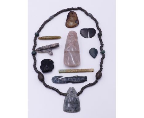 TEN VARIOUS PRE-COLUMBIAN AND OTHER JADE & HARDSTONE PENDANTS TO INCLUDE A CELT WITH AXE GOD DECORATION, A CROCODILE, A PIERC