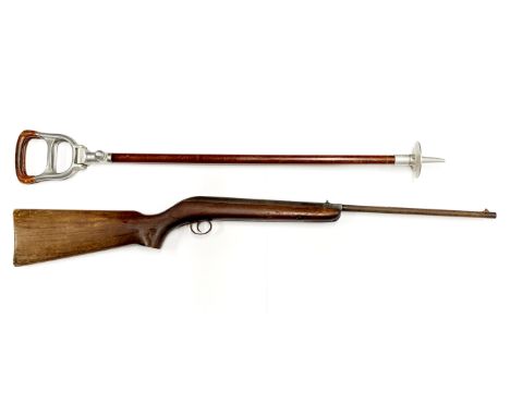 An antique BSA air rifle and shooting stick.