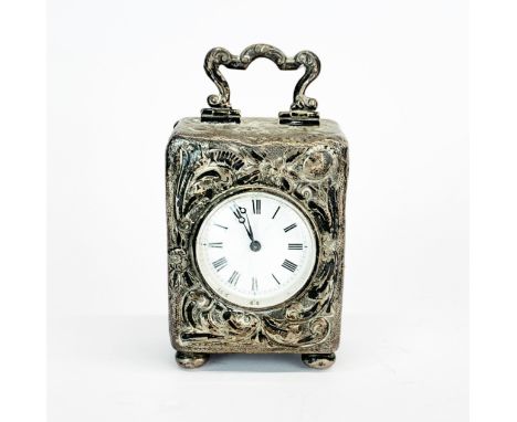 A lovely hallmarked silver antique miniature clock, H. 9cm. Not in working order.