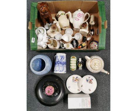 A box of mixed ceramic and other items.