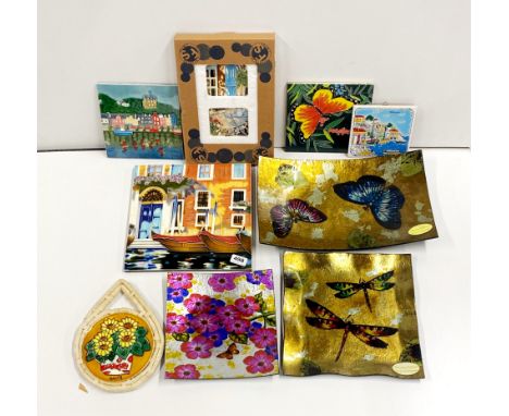 A group of glass dishes and ceramic tiles.