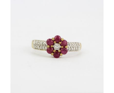 A 9ct yellow ruby and diamond set cluster ring, (N).