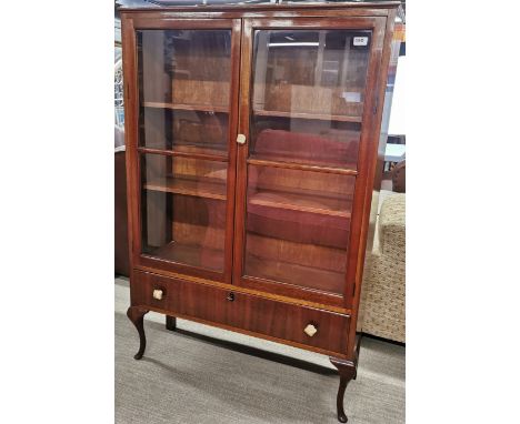 A mahogany three shelf display cabinet with a single bottom drawer, 139 x 93cm.