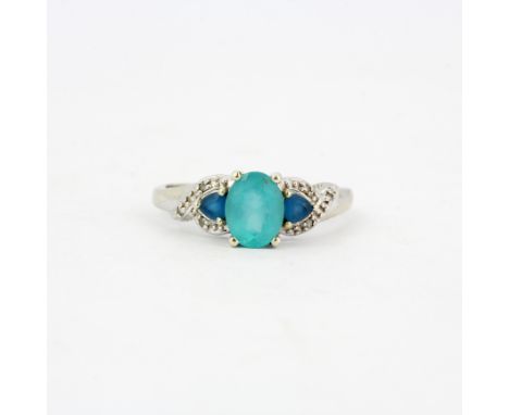 A 9ct white gold (stamped 9K) ring set with apatite, blue topaz and diamonds, (R ).